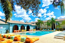 Poolside seating by Olympic style swimming pool.